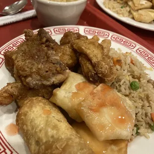 Fried chicken, sesame chicken, egg roll, crab puff, and fried rice (egg drop soup in the back!)