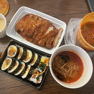 Spicy pork kimbap, spicy shredded beef soup, and pork cutlet