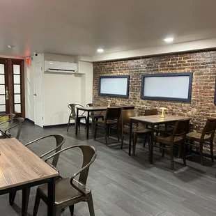 a dining area with tables and chairs