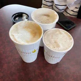 three cups of coffee on a table