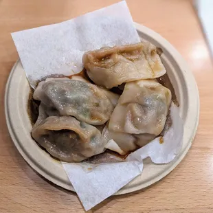 a bowl of dumplings on a table