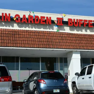 cars parked in front of a restaurant