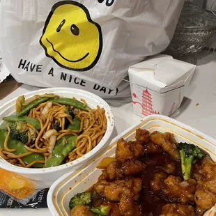 two take out containers of chinese food