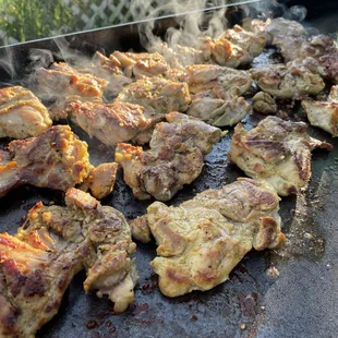 chicken cooking on a grill