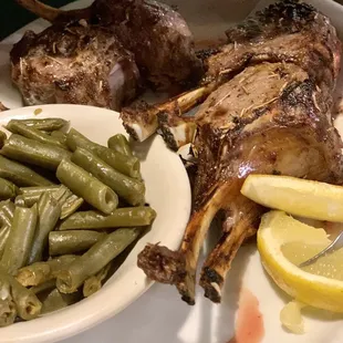 a plate of meat and green beans