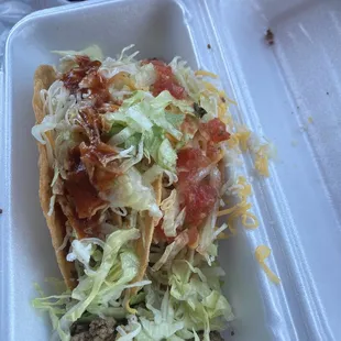 Ground Beef Taco with red salsa on one and pico on the other. Super tasty.