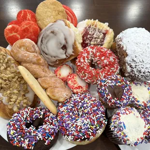 a variety of doughnuts on a plate