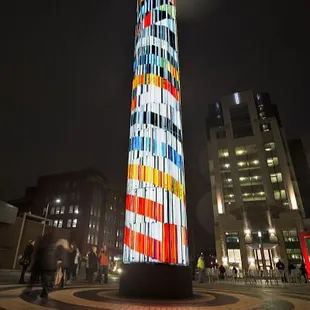 57 foot tower lit up at night.