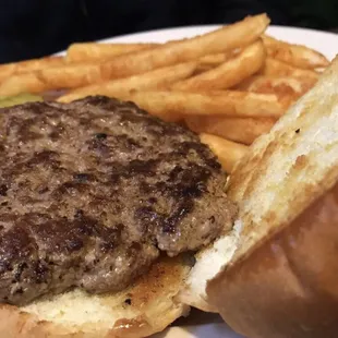 a hamburger and fries on a plate