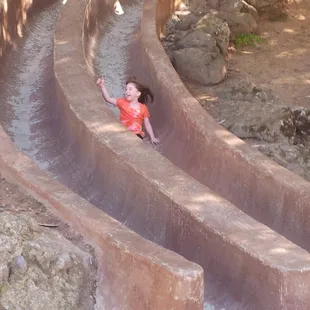 Having fun on the cement slides!