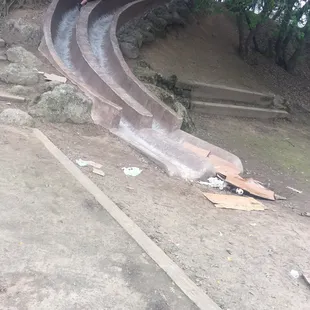 Garbage at the end of the cement slide.