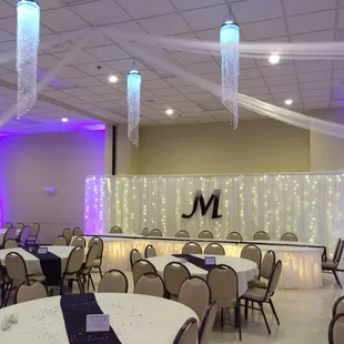 Beautiful wedding reception! Check out our chandeliers, part of the decorating we offer!