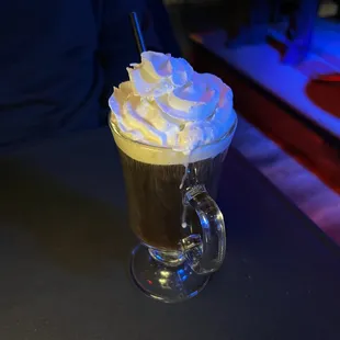 a cup of coffee with whipped cream