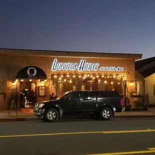 a car parked in front of a restaurant