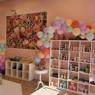 a candy shop with balloons