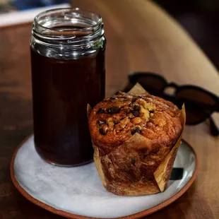 a muffin and a jar of coffee