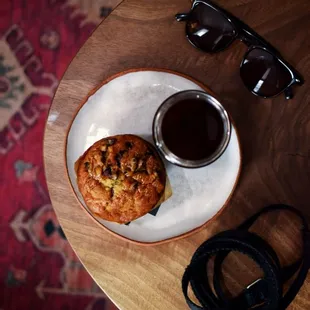 a muffin and a cup of coffee