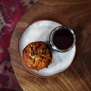 a muffin and a cup of coffee