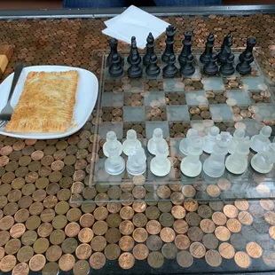 Our handpie next to a penny table we were sitting at with chess
