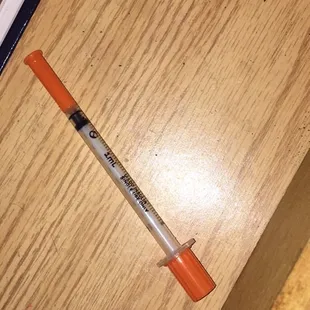 This needle was found in the bed. My bf picked it up and move it away&amp;fastened the cap. This place is dirty. Do not stay here