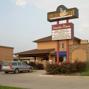 cars parked in front of a restaurant