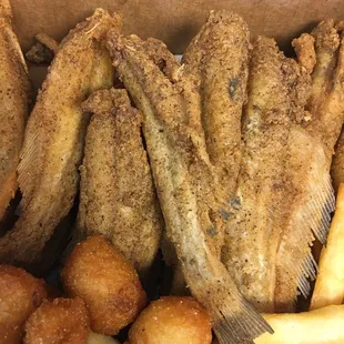 a box of fried fish and french fries