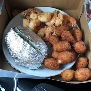 Fantail shrimp with baked potato and hush puppies!  Awesome!