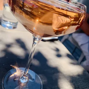 a glass of rose wine