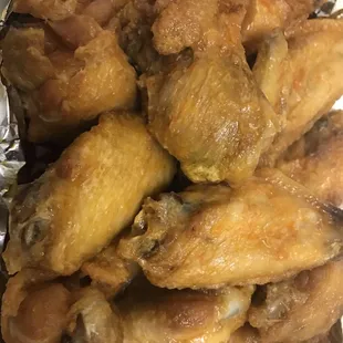 a pile of chicken wings