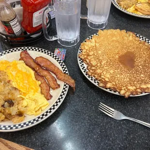 pancakes, eggs, hash browns, and bacon
