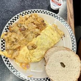 Lyonnaise potatoes, ham-cheese omelette, and bagel