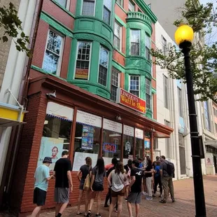 a crowd of people walking by