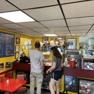 a man and a woman at a drive - in