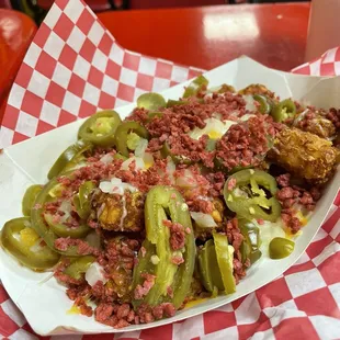 Loaded tots: tater tots, cheese, onion, jalapeños, and imitation bacon bits.