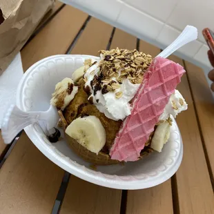 This is the Fried Ice Cream :) We also got a cinnamon stick which was Really good dipped in the ice cream and whip cream .