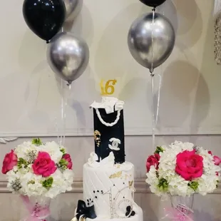 a wedding cake and balloons