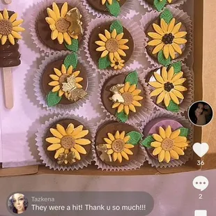 a box of sunflower cupcakes