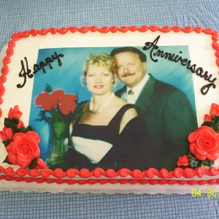 a picture of a couple on a anniversary cake