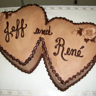 two heart shaped cakes with the words jeff and rone written on them