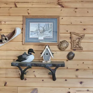 wo ducks on a shelf