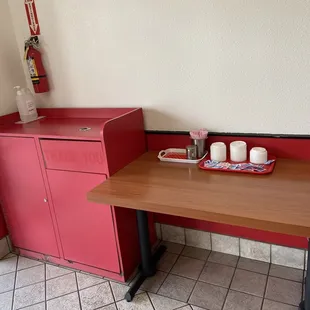 a table with a tray of donuts on it