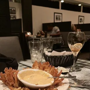 a plate of fried shrimp and dipping sauce