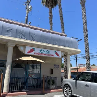 a car parked in front of a restaurant