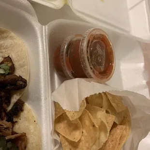 Carnitas and carne asada tacos, Chile verde wet burrito. Nachos and salsa