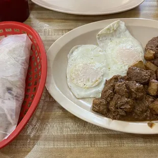 Guisada y juevos y papas..homemade tortillas..all delicious, hot &amp; fresh food.