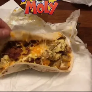 a person eating a burrito