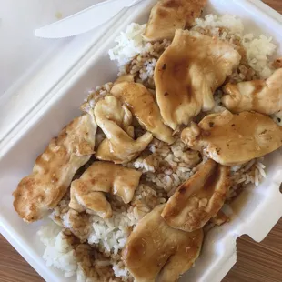 chicken and rice in a styrofoam container