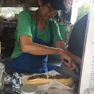 Linda preparing my cheese steak!