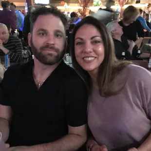 a man and a woman at a restaurant