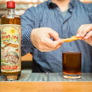 a man preparing a drink at a bar